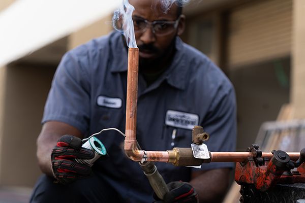 plumber welding a pipe  